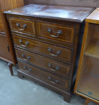 A George III style inlaid mahogany chest of drawers