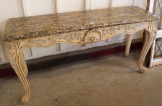 An Italian Rococo style painted faux marble console table