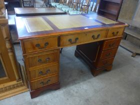 A leather topped pedestal desk