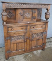 A 17th Century style carved oak court cupboard