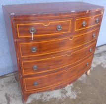 A Regency inlaid mahogany bow front chest of drawers