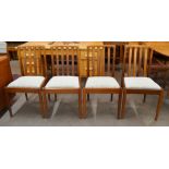 A set of four Meredew teak dining chairs