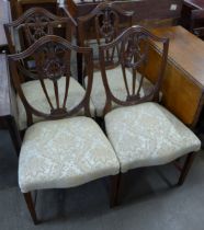 A set of four Hepplewhite Revival mahogany dining chairs