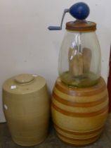 A vintage butter churn and two bottles