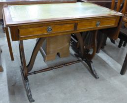 A Regency style mahogany and green leather topped sofa table