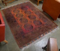 An Afghan terracotta ground rug