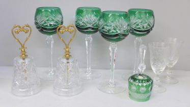 Four Bohemian green glass cut wine glasses and matching bell, two crystal bells with gilded heart