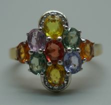 A silver gilt, multi-colour sapphire and white topaz cluster ring, T/U