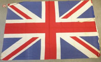 Three Union Jacks and four other flags; Canadian Red Ensign, Australia Red Ensign, British Empire