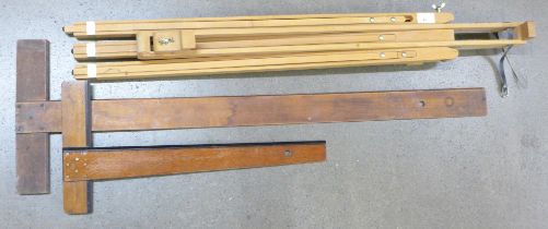 An artist's wooden easel and two draughtsman's squares