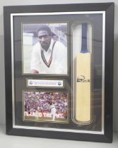 A display presentation case and small cricket bat signed by West Indies legend Sir Vivian Richards