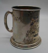 A silver mug with inscription dated 1933, 63g