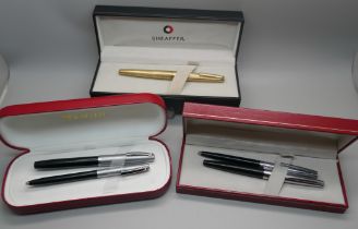 A plated Sheaffer pen with 14k gold nib and two Sheaffer pen sets