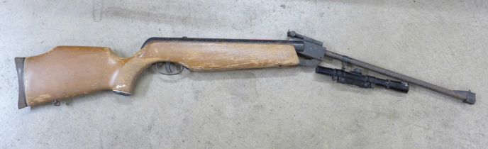 A .22 Superfire Power Magnum air rifle by ASI and an ASI 4 x 20 scope