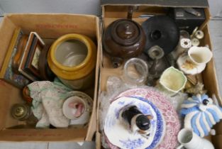 Two boxes of assorted china, metalwares, needleworks and a Manor Collectibles model of a British