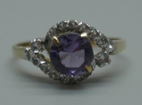 A yellow metal, amethyst and white stone cluster ring with continental marks, 1.8g, O