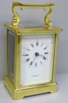 An English brass and four glass sided carriage clock