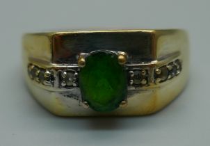 A silver gilt, green and white stone ring, T