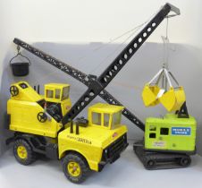 A 1970s Mighty-Tonka crane and a smaller green crane
