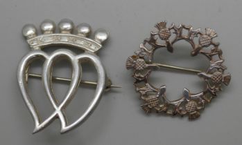 A Scottish silver Luckenbooth brooch by Thomas Kerr Ebbutt and a silver thistle brooch