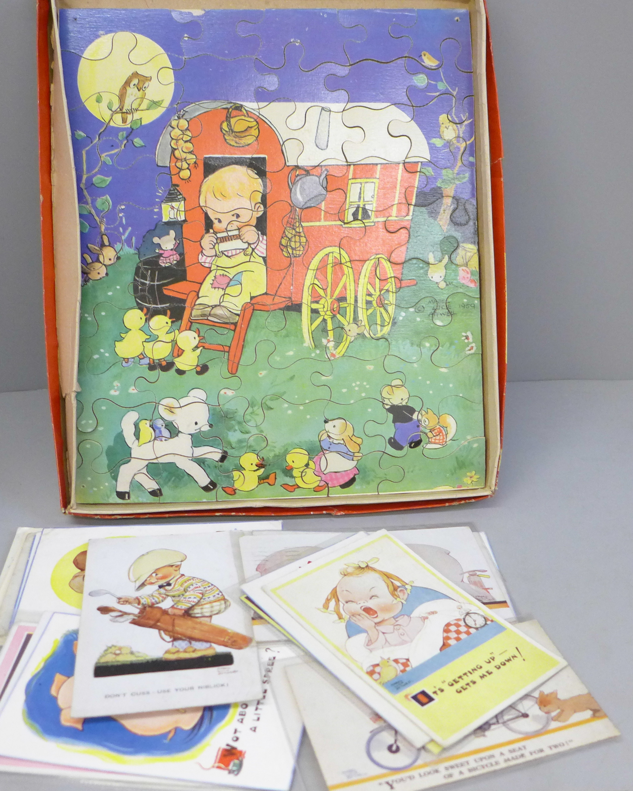 A Mabel Lucie Attwell jigsaw and 33 Mabel Lucie Attwell postcards