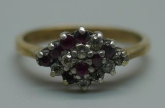 A silver gilt, diamond and ruby cluster ring, L/M