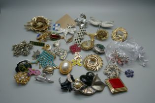 Forty badges, scarf clips and brooches