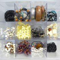 A box of costume jewellery; ethnic earrings, bangles, Antler abstract necklace, etc.