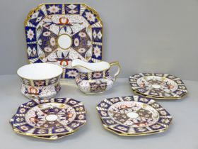 A Carlton Ware Imari pattern sandwich set; a large plate and six small plates, milk and sugar