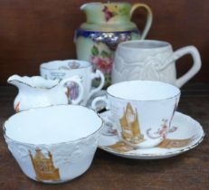 A Carlton Ware jug, two Edward VII commemorative cups and saucers, a commemorative cream jug and