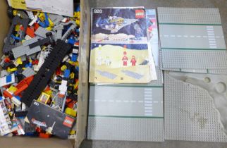 A box of vintage Lego and Lego brochures, instructions, etc.