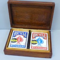 An Edward VII inlaid mahogany two compartment card box and two packs of cards