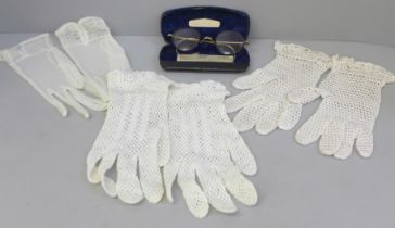 Three pairs of lady's gloves and a pair of vintage spectacles, cased