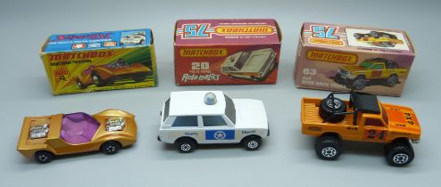 Three vintage Matchbox 75 cars in original boxes, a 20 Police Patrol Rola-Matics, a 63 4x4 Open Back