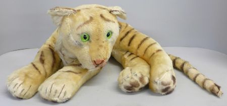 A vintage Steiff recumbent tiger