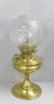 A Victorian brass messenger oil lamp with chimney and etched glass shade **PLEASE NOTE THIS LOT IS