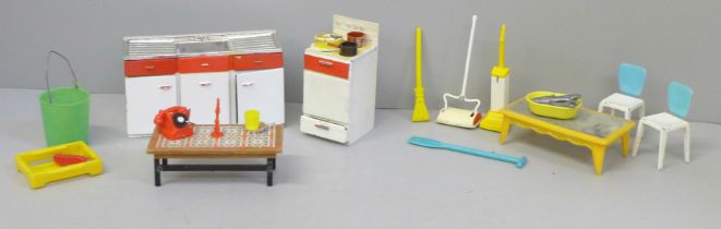 A box of Tri-ang kitchen toys