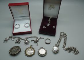 A pair of 9ct white gold earrings, 1.5g, a silver charm bracelet with articulated charms including