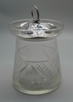 A glass preserve pot with silver Arts and Crafts lid, Birmingham 1902, maker C & F, (matched lid and