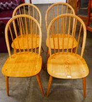 A set of four Ercol Blonde ash and beech Windsor chairs
