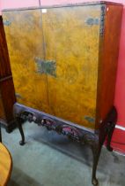 A Queen Anne style burr walnut cocktail cabinet