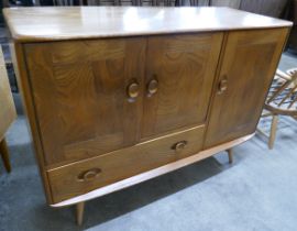 An Ercol Blonde elm and beech Windsor sideboard