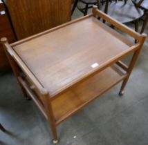 A Danish teak two tier cocktail trolley