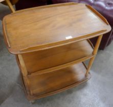 An Ercol Blonde elm and beech Windsor trolley