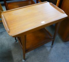 A teak cocktail trolley