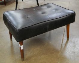 A Miss Muffet black vinyl stool