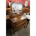 An early 20th Century oak dressing chest