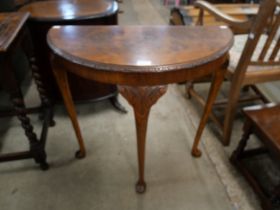 A burr walnut demi-lune hall table