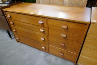 A teak chest of drawers