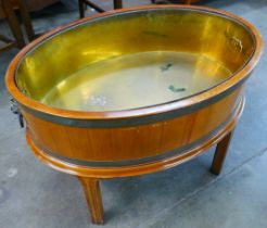 A George III style mahogany and brass wine cooler
